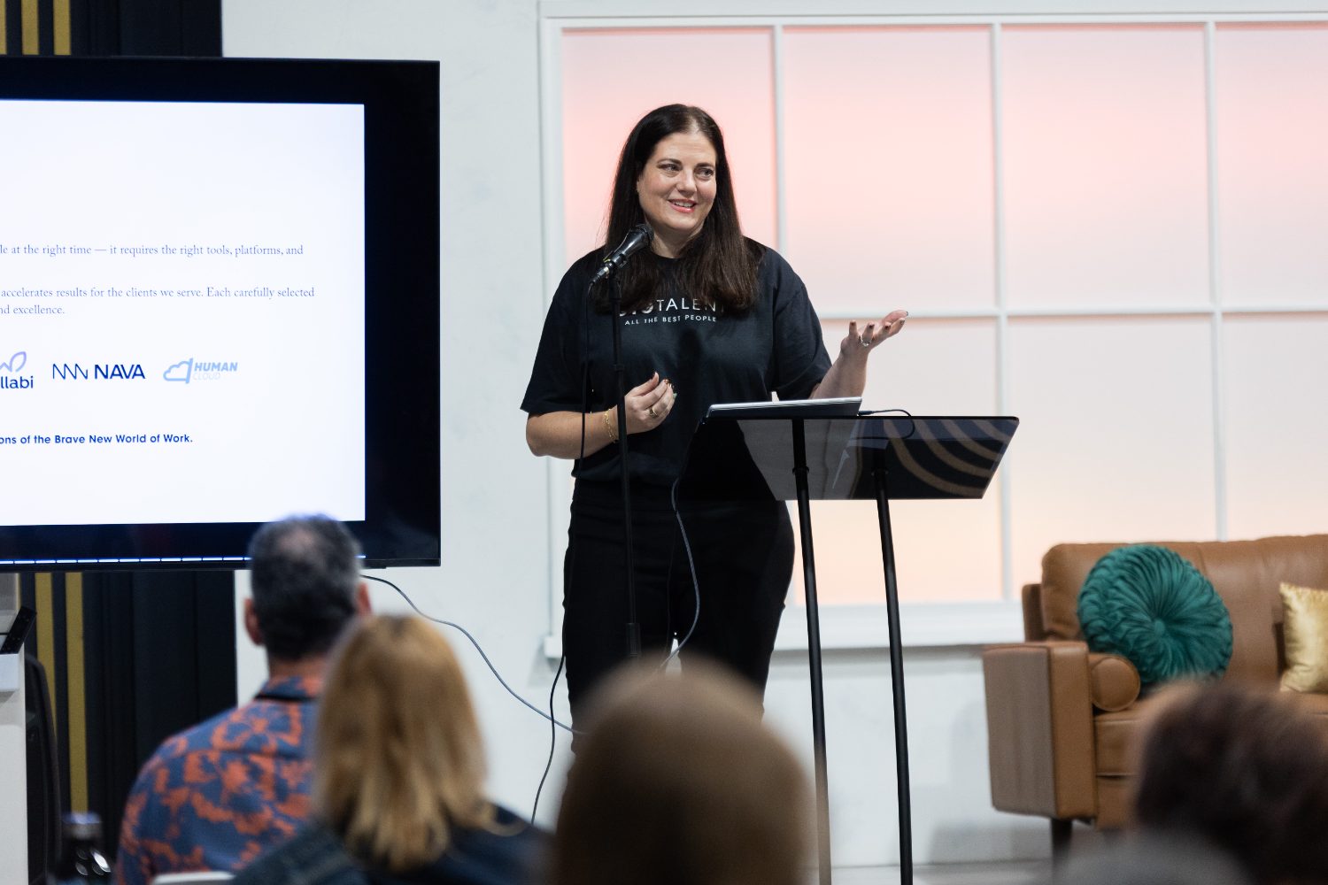 Jamie Latiano Jacobs delivering a keynote to an audience